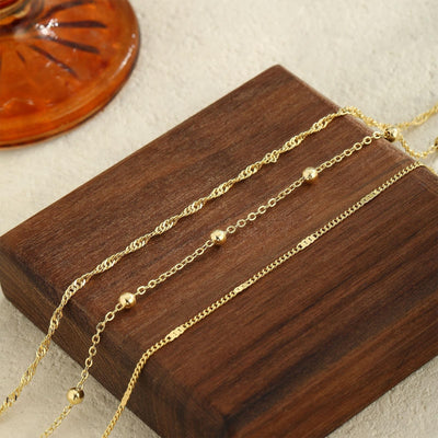 Three 14K gold plated Cuban link beaded anklets stacked together, waterproof stackable set by GOSFRY