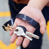 Black polyester wristlet keychain lanyard with white lightning bolt graphic and detachable metal clip for keys and badges - view 4