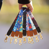 Black polyester wristlet keychain lanyard with white lightning bolt graphic and detachable metal clip for keys and badges - view 6