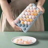 Two round sphere ice ball maker trays with lids in pink and blue BPA-free plastic for whiskey and cocktails - view 8