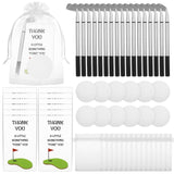 24 golf club shaped ballpoint pens, notepads, organza bags, and thank-you cards arranged as party favor sets