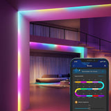 Govee H618C RGBIC 32.8ft LED strip lights displaying multiple colors simultaneously along a wall or room edge - view 2