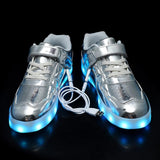 Silver kids LED light-up sneakers with hook and loop closure, size 1, shown from side angle highlighting sole lighting - view 4