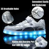 Silver kids LED light-up sneakers with hook and loop closure, size 1, shown from side angle highlighting sole lighting - view 2