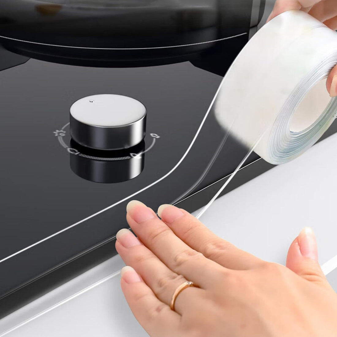 Clear self-adhesive PVC caulk strip tape 1.5 inch wide applied along bathtub and countertop seam edge