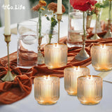Set of 6 clear ribbed glass candle holders 3.5 inches holding tea light and votive candles on a decorated table - view 4