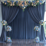 Four navy blue silky backdrop curtain panels 5x12 feet hung on a rod, showing smooth wrinkle-free drape for wedding or photo booth use - view 3