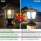 Two matte black solar post cap lights with glass shades mounted on 4x4 wood fence posts glowing warm white LED light - view 5