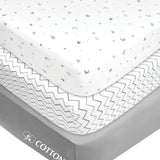 Three folded gray star and zigzag print fitted mini crib sheets 24x38 inch by American Baby Company in packaging