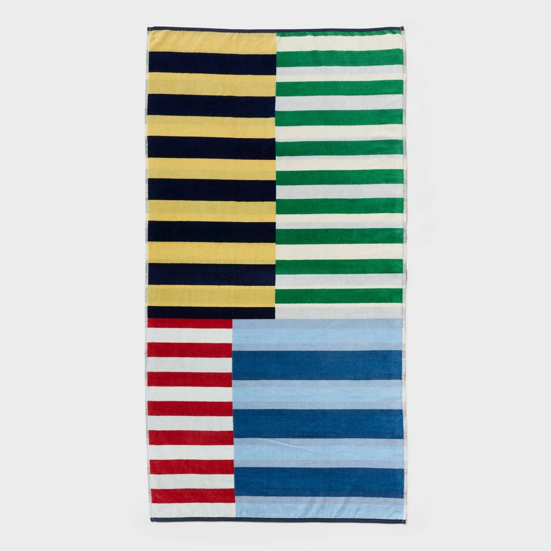 Room Essentials 36x72 oversized beach towel with multicolor nautical four-quadrant candy stripe pattern on white background