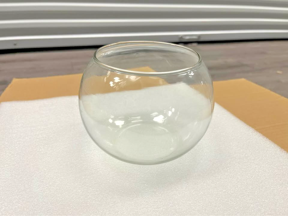Set of 4 clear round glass bubble bowl vases 5.97 inches wide displayed as candle holders and flower vases for wedding decor