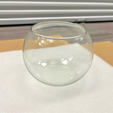 Set of 4 clear round glass bubble bowl vases 5.97 inches wide displayed as candle holders and flower vases for wedding decor