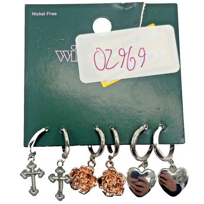 Wild Fable 3-pair silver and rose gold hoop earrings with heart, rose flower, and cross charms on display card
