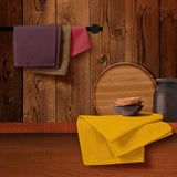 Four waffle weave cotton kitchen dish towels in brown, burgundy, red, and mustard, each 16x26 inches with hanging loop - view 7