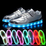 Silver kids LED light-up sneakers with hook and loop closure, size 1, shown from side angle highlighting sole lighting - view 3