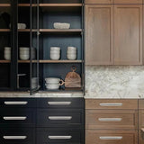 Five brushed nickel zinc alloy 7-inch cup pulls for kitchen cabinet drawers arranged on a white surface - view 5