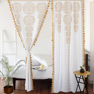 Two white and gold sheer cotton Indian mandala boho curtains with pom pom lace trim, 87 inches long by 41 inches wide