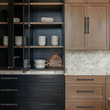 Ten matte black zinc alloy oval bar cabinet pulls with 10-inch center-to-center spacing arranged on a white surface - view 2