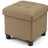 Small square khaki linen storage ottoman with wood legs and reversible lid, 12.6 inches, folded flat beside a living room sofa
