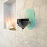 Seafoam silicone wine glass holder mounted on glossy shower tile using patented grip technology, no suction cups - view 8