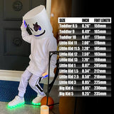 Silver kids LED light-up sneakers with hook and loop closure, size Big Kid 1, showing glowing sole lights - view 6