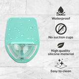 Seafoam silicone wine glass holder mounted on glossy shower tile using patented grip technology, no suction cups - view 2