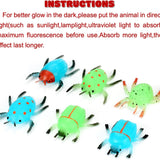 24 glow-in-the-dark rubber bug toys with Valentine's Day cards arranged on a surface, fluorescent green bugs by Axbotoy - view 4