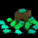 24 glow-in-the-dark rubber bug toys with Valentine's Day cards arranged on a surface, fluorescent green bugs by Axbotoy - view 7