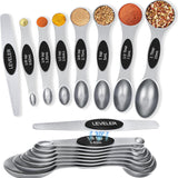 Set of 8 silver stainless steel magnetic measuring spoons with dual-sided design and leveler on white background